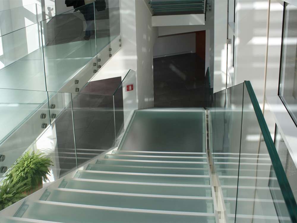 Glass staircase with matt glass treads London Stairs Bond Street