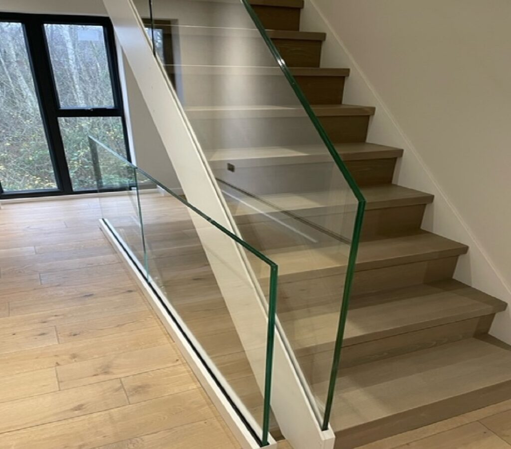 Luxury oak staircase sandwiched glass railing